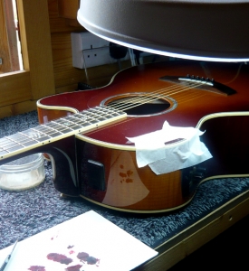 Dent repair to acoustic www.guitarlodge.co.uk