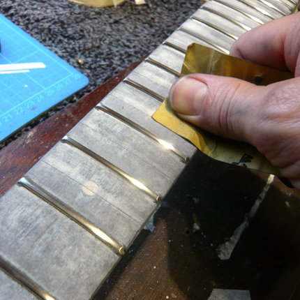 Smoothing off the frets: