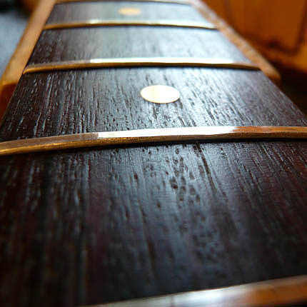 This fingerboard needs re-fretting: